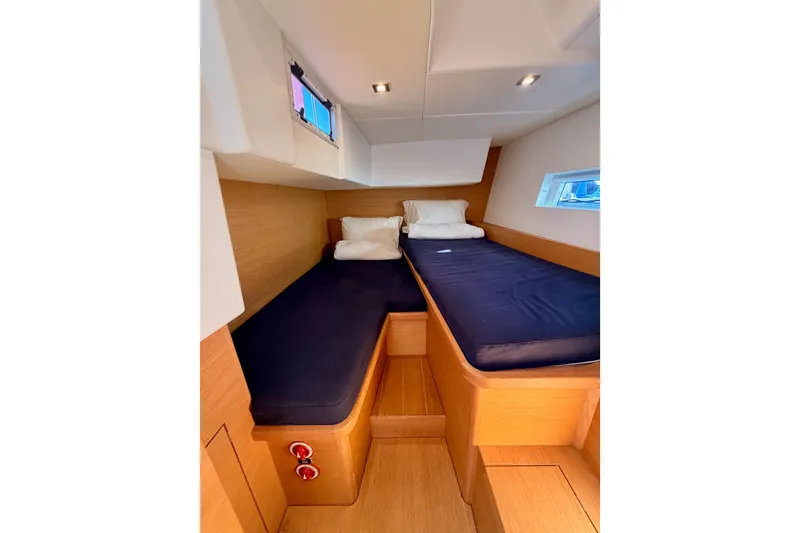Slide: The Image of Cozy cabin interior of 2017 Solaris 50 yacht with twin beds and wooden finish. - 74