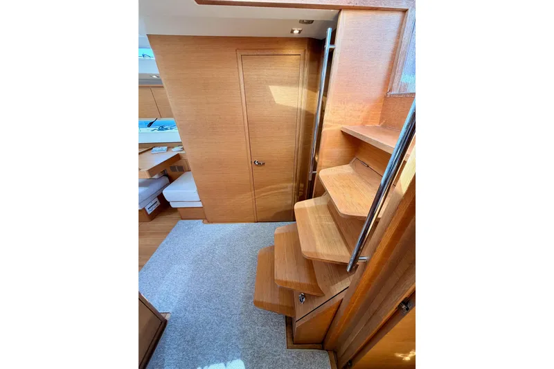 Slide: The Image of Interior of 2017 Solaris 50 yacht featuring wooden stairs and modern design elements. - 77