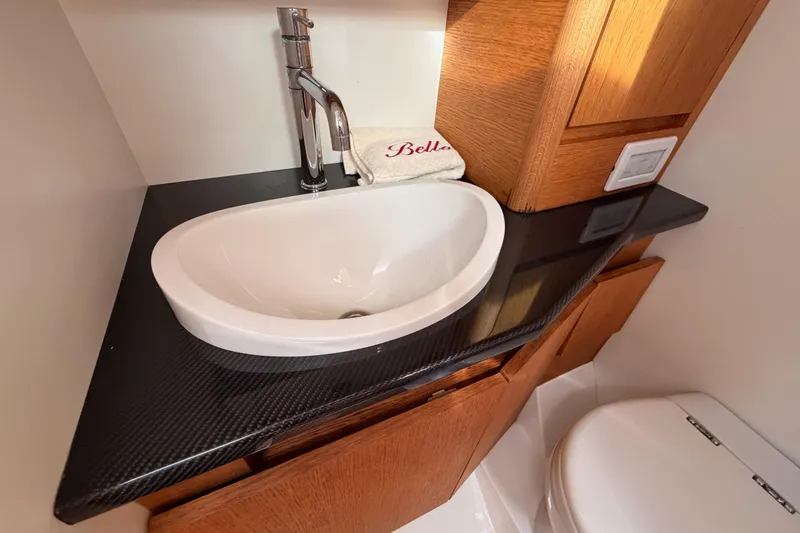 Slide: The Image of Luxurious bathroom interior of 2017 Solaris 50 yacht with modern fixtures and wooden accents. - 79