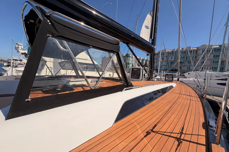 Slide: The Image of Luxurious 2017 Solaris 50 yacht with sleek wooden deck and modern design in marina setting. - 8