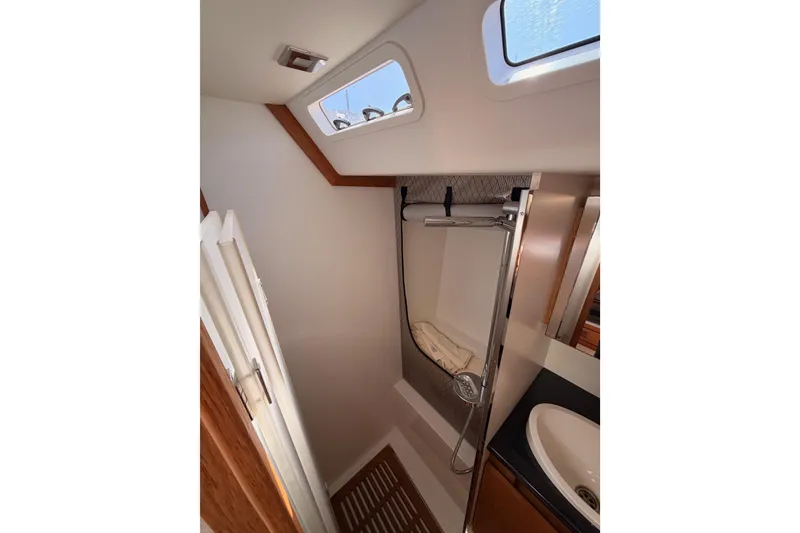 Slide: The Image of Luxurious bathroom sink in 2017 Solaris 50 yacht with wooden cabinetry and modern fixtures. - 80