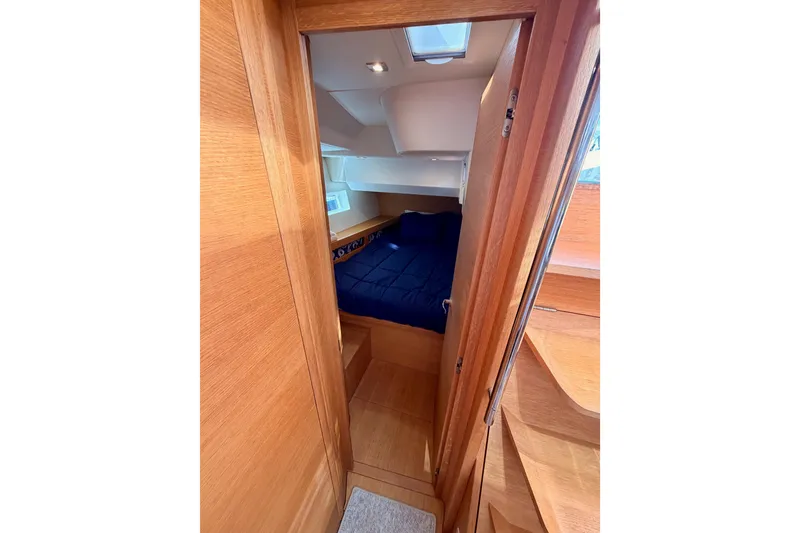 Slide: The Image of Interior of 2017 Solaris 50 yacht featuring a compact, modern bathroom with wooden accents. - 82