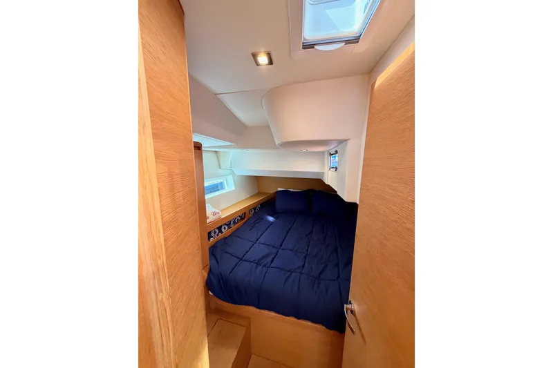 Slide: The Image of Cozy cabin interior of 2017 Solaris 50 yacht with blue bedding and wooden accents. - 83