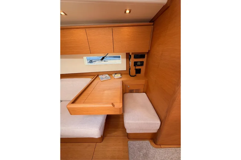 Slide: The Image of Interior of 2017 Solaris 50 yacht with wooden cabinetry and seating area. - 88