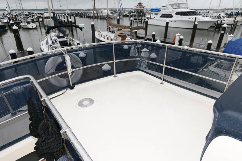 Slide: The Image of Deck of a 2005 Mainship 400 Trawler in the marina. - 10