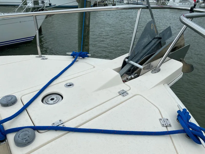 Slide: The Image of Mainship 400 Trawler 2005 bow view with anchor and blue ropes. - 11