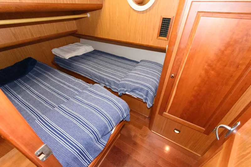 Slide: The Image of Interior of 2005 Mainship 400 Trawler with twin beds. - 19