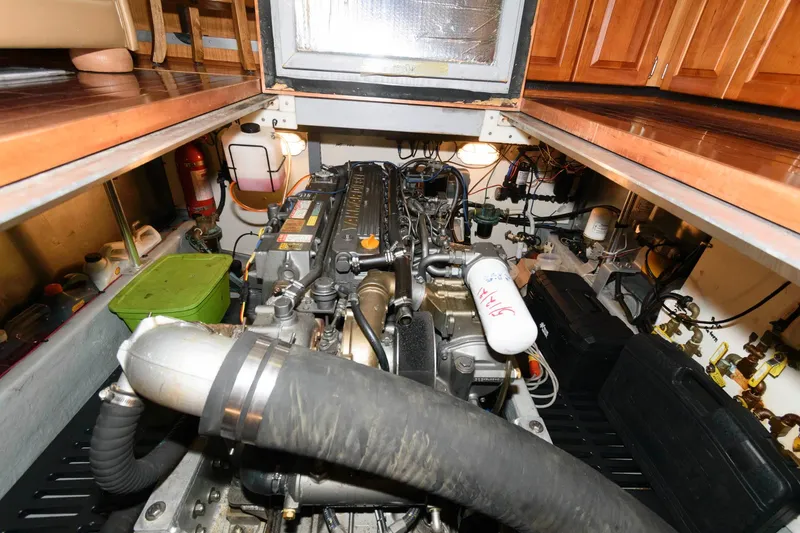 Slide: The Image of Engine room of a 2005 Mainship 400 Trawler with visible engine. - 21