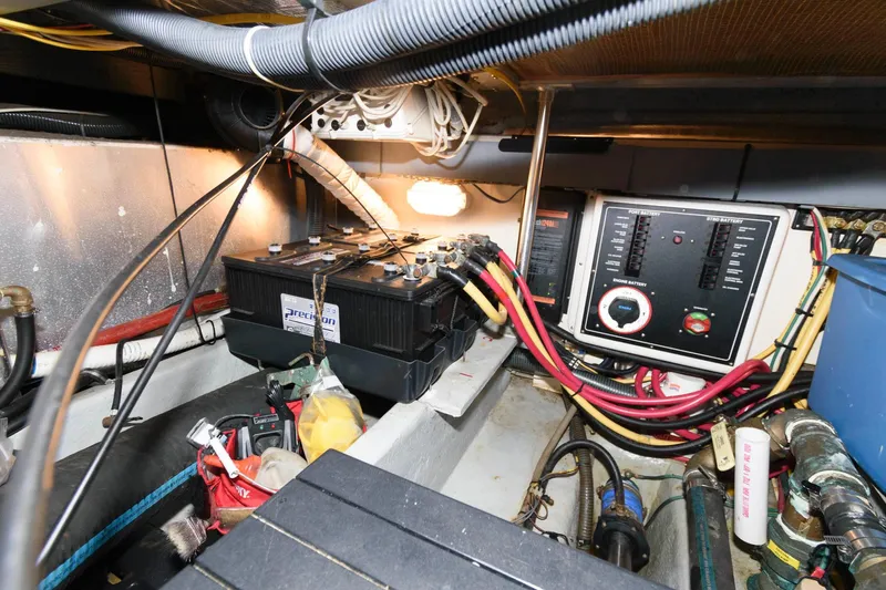 Slide: The Image of Engine room of 2005 Mainship 400 Trawler with battery and wiring. - 22