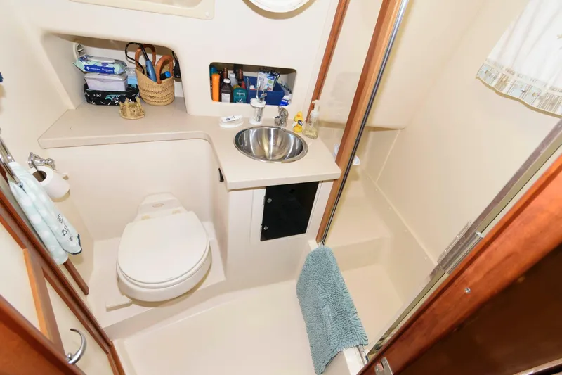 Slide: The Image of Bathroom in 2005 Mainship 400 Trawler with sink and toilet. - 28