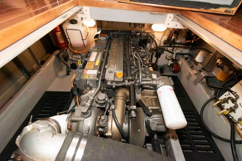 Slide: The Image of Engine room of a 2005 Mainship 400 Trawler, showcasing detailed machinery and components. - 29