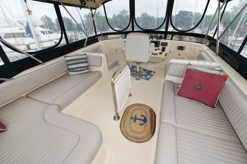 Slide: The Image of Interior of a 2005 Mainship 400 Trawler with seating and helm station. - 3