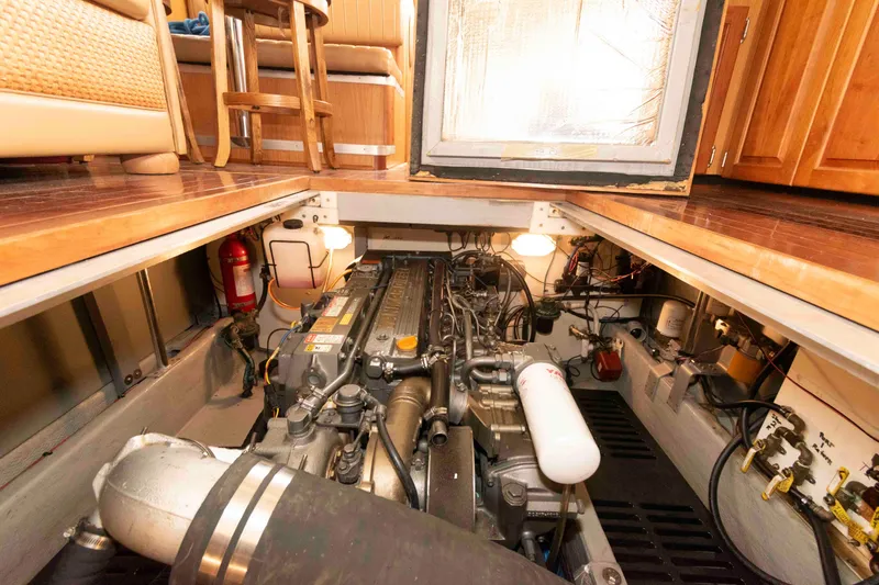 Slide: The Image of Engine room of a 2005 Mainship 400 Trawler, showcasing detailed mechanical components. - 30