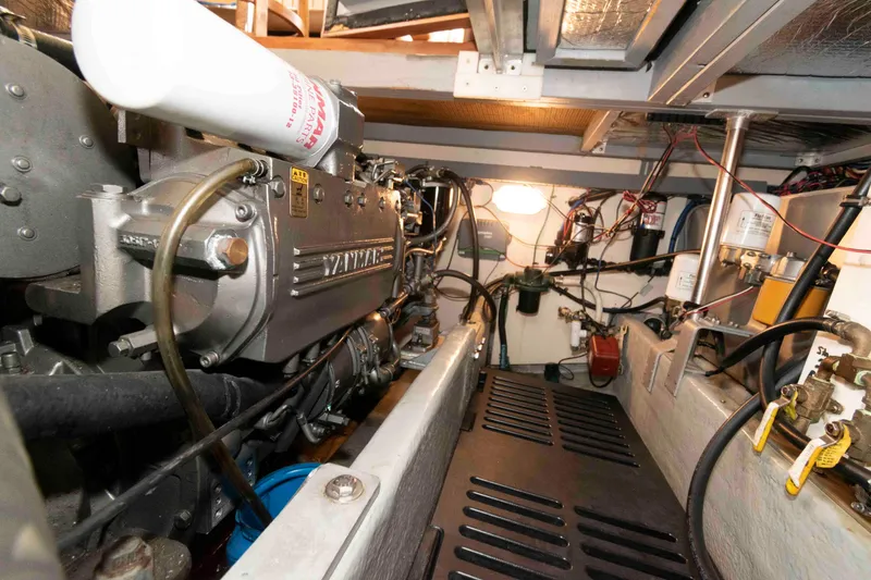 Slide: The Image of Engine room of a 2005 Mainship 400 Trawler, featuring a Yanmar engine. - 31