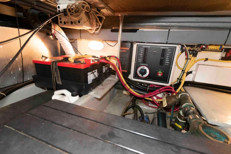 Slide: The Image of Engine room of a 2005 Mainship 400 Trawler with battery and control panel. - 34