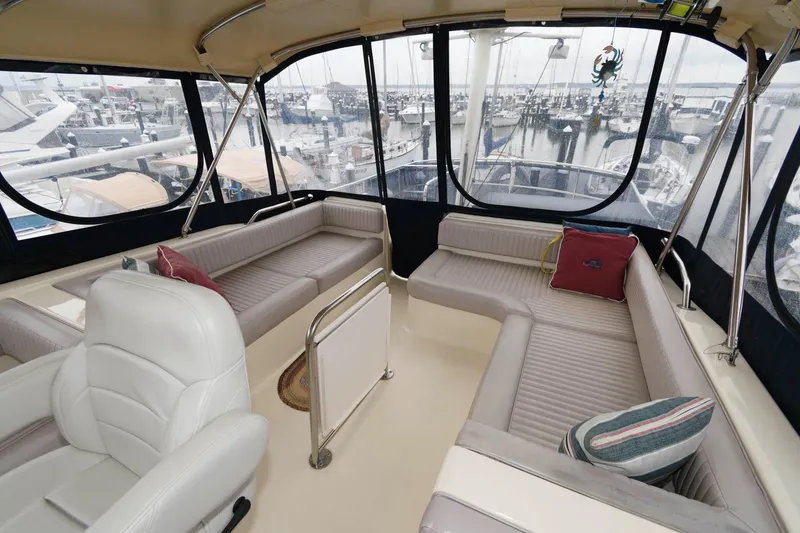 Slide: The Image of Interior of a 2005 Mainship 400 Trawler yacht with harbor view. - 4