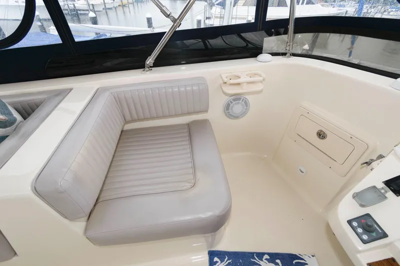 Slide: The Image of Interior of a 2005 Mainship 400 Trawler with seating area. - 6
