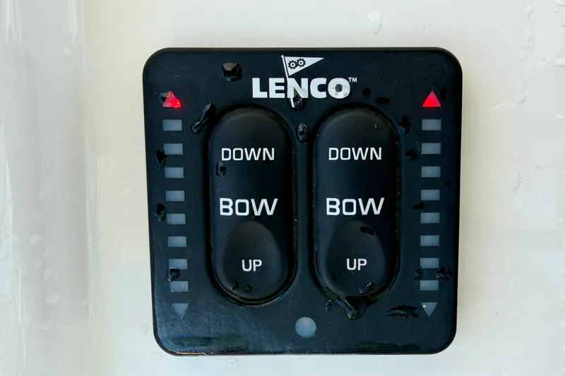 Slide: The Image of Control panel for Lenco trim tabs on a 2019 Regulator 31 boat. - 14