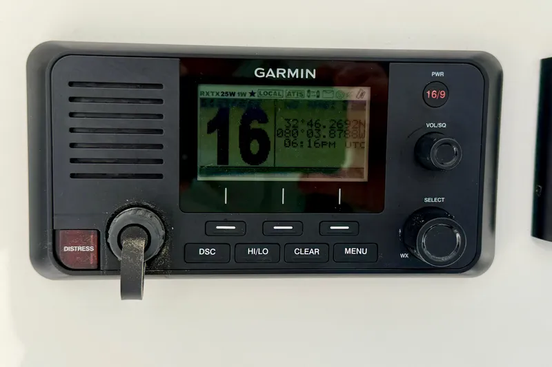 Slide: The Image of Garmin marine radio on a 2019 Regulator 31 boat, displaying channel 16. - 17