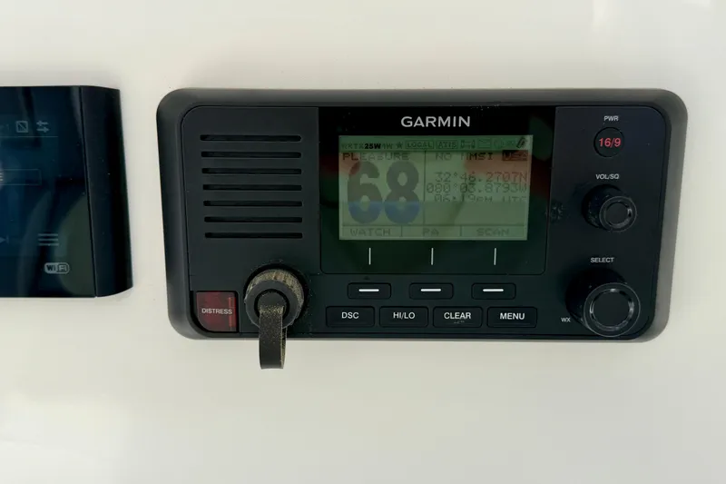 Slide: The Image of Garmin marine radio on a 2019 Regulator 31 boat dashboard. - 18