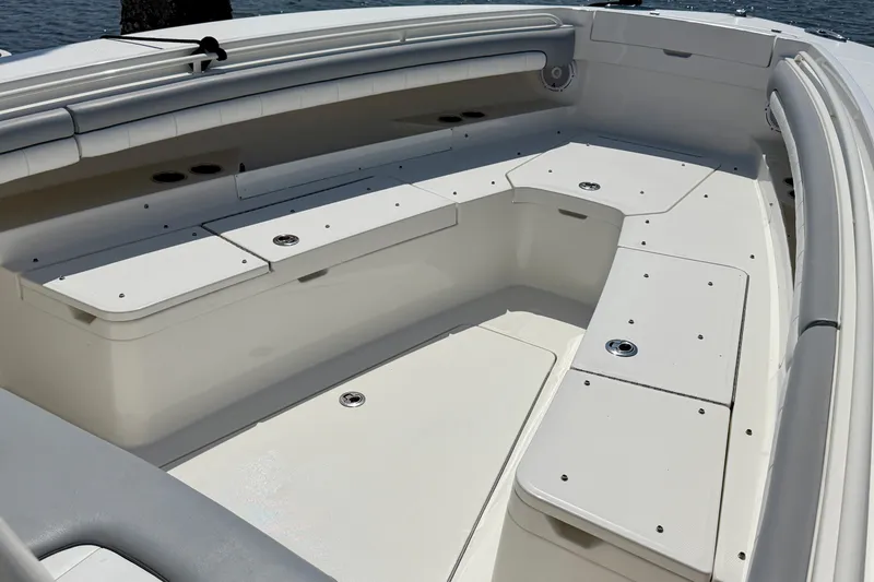 Slide: The Image of 2019 Regulator 31 boat interior with spacious seating and storage compartments. - 20