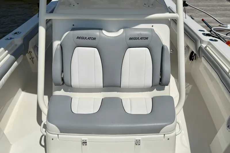 Slide: The Image of 2019 Regulator 31 boat seating with gray and white cushioned design. - 23