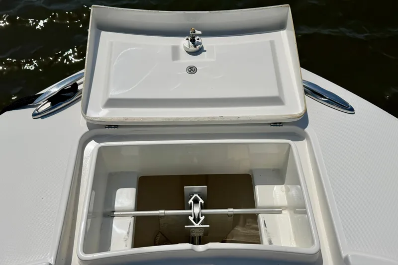 Slide: The Image of Open storage compartment on a 2019 Regulator 31 boat, showing interior details. - 24