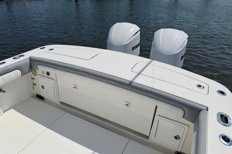 Slide: The Image of 2019 Regulator 31 boat with dual Yamaha outboard engines on calm water. - 27