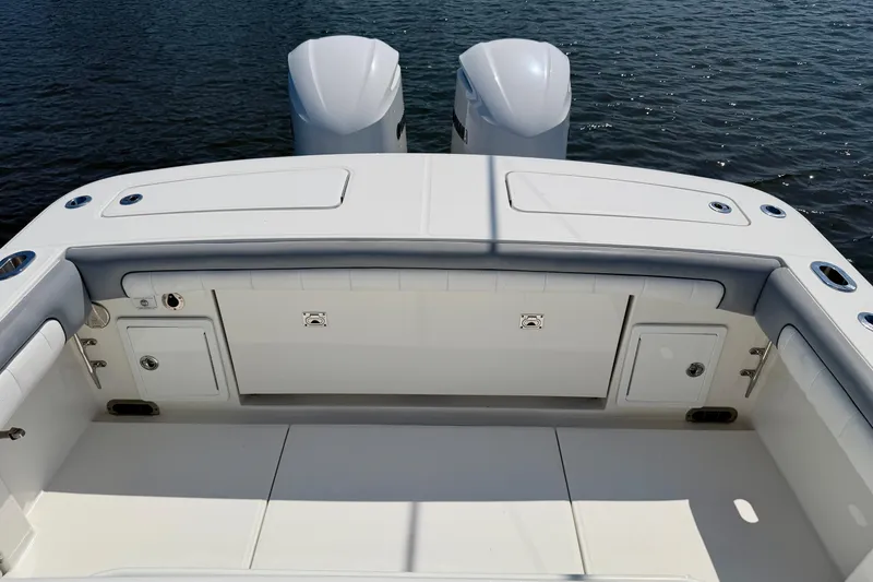 Slide: The Image of 2019 Regulator 31 boat deck with dual engines on calm water. - 28