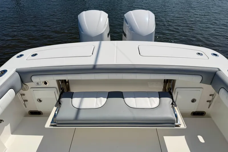 Slide: The Image of 2019 Regulator 31 boat with dual engines and foldable seating on deck. - 29