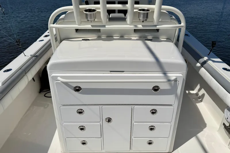 Slide: The Image of 2019 Regulator 31 boat with storage compartments and rod holders on deck. - 32