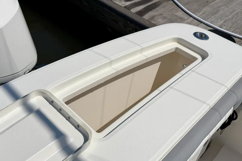 Slide: The Image of 2019 Regulator 31 boat deck with open storage compartment. - 36