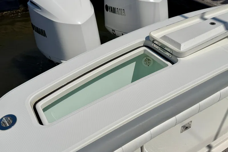 Slide: The Image of 2019 Regulator 31 boat with Yamaha engines and open storage compartment. - 37