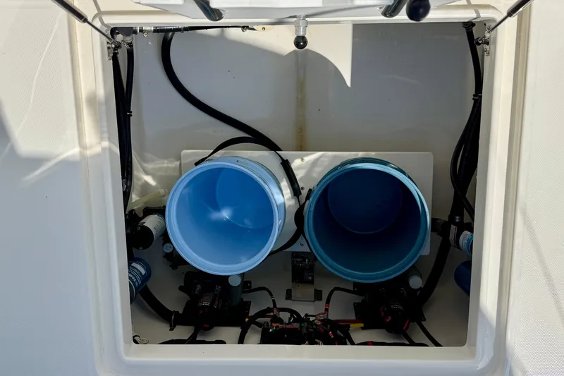Slide: The Image of 2019 Regulator 31 boat compartment with blue filters and wiring. - 38
