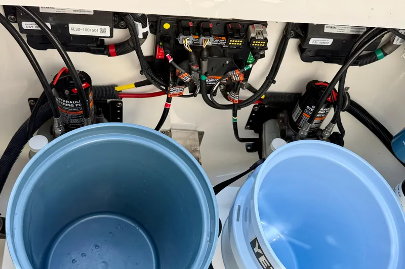 Slide: The Image of 2019 Regulator 31 boat hydraulic steering system with blue buckets. - 40