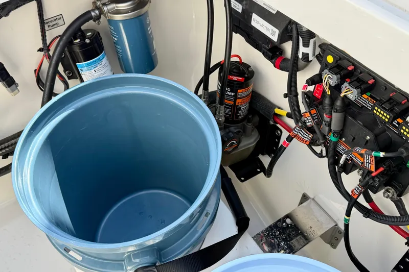 Slide: The Image of 2019 Regulator 31 boat wiring and pump system with blue container. - 42