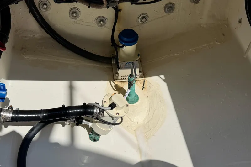 Slide: The Image of Bilge area of 2019 Regulator 31 boat with pump and hoses visible. - 43