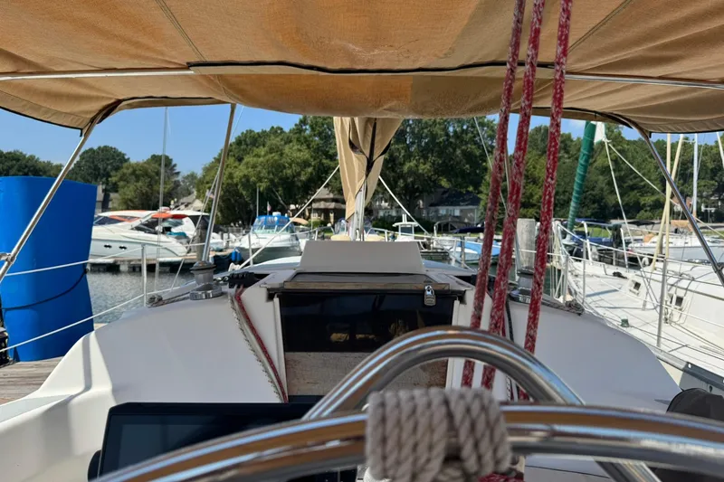 Slide: The Image of Cockpit view of a 1994 Hunter 29.5 sailboat docked at a marina. - 14
