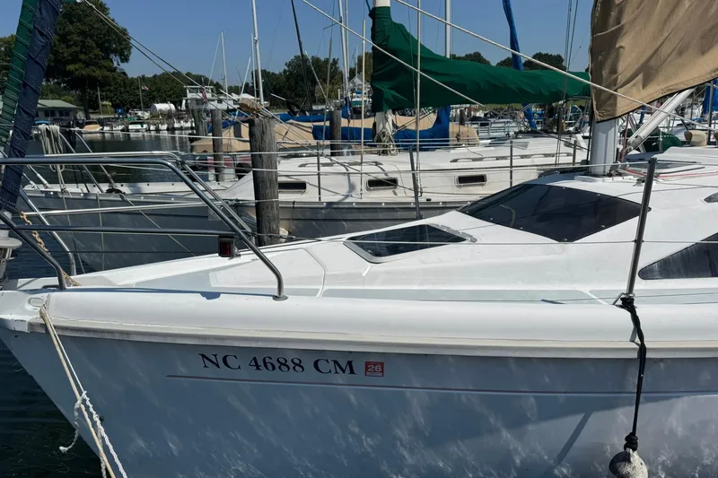 Slide: The Image of Sailboat docked in marina, 1994 Hunter 29.5 model, registration NC 4688 CM. - 2