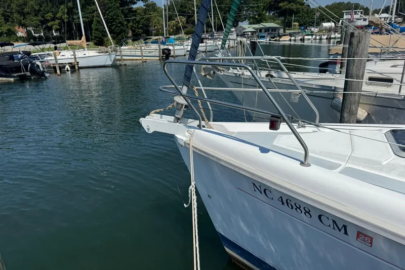 Slide: The Image of Hunter 29.5 sailboat from 1994 docked in a marina, registration NC 4688 CM. - 3