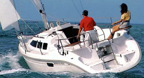 Slide: The Image of 1994 Hunter 29.5 sailboat navigating the ocean. - 40