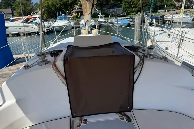 Slide: The Image of 1994 Hunter 29.5 sailboat cockpit with marina view in background. - 5