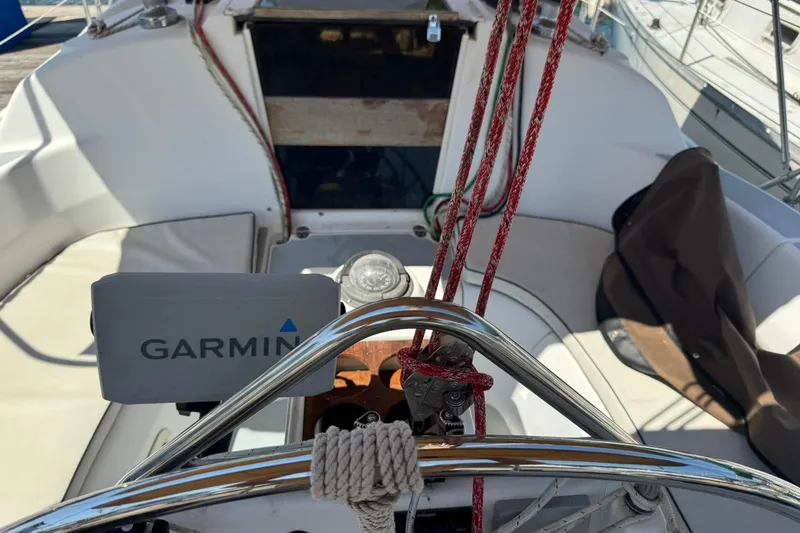 Slide: The Image of Cockpit of a 1994 Hunter 29.5 sailboat with Garmin navigation equipment. - 9