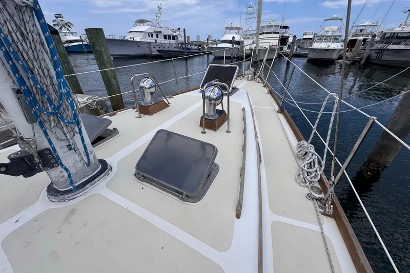 Slide: The Image of 1981 Gulfstar 44 Mk II Center Cockpit Sloop docked, showcasing deck and rigging details. - 36