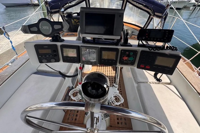 Slide: The Image of Cockpit of 1981 Gulfstar 44 Mk II Sloop with navigation instruments and steering wheel. - 43