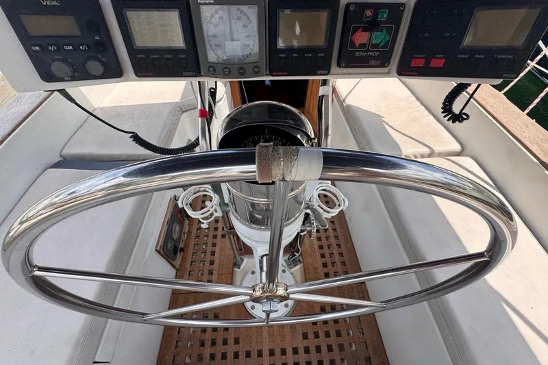Slide: The Image of Steering wheel and controls of a 1981 Gulfstar 44 Mk II Center Cockpit Sloop. - 45