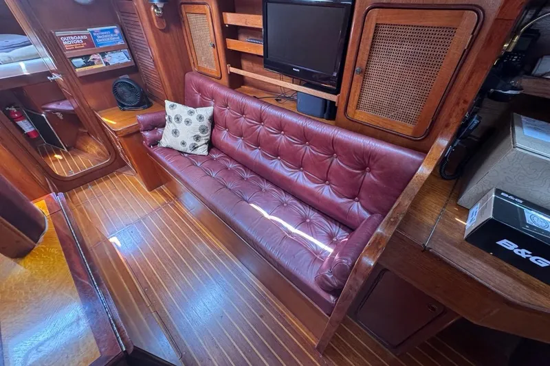 Slide: The Image of Interior of 1981 Gulfstar 44 Mk II Sloop with leather seating and wooden cabinetry. - 48