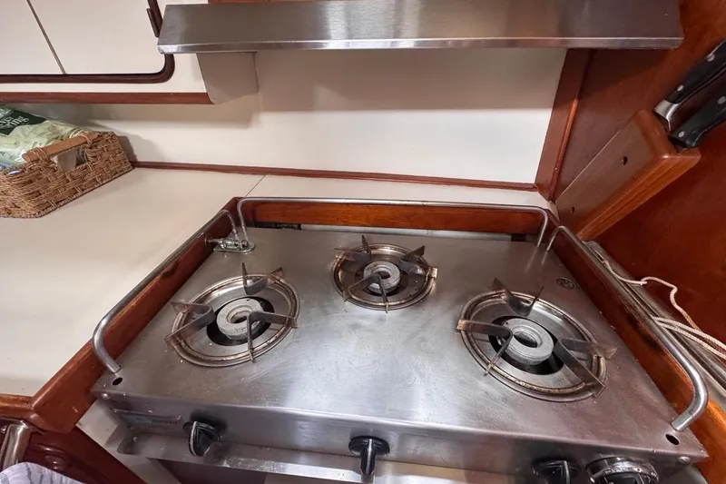 Slide: The Image of Three-burner stove in 1981 Gulfstar 44 Mk II Center Cockpit Sloop galley. - 51