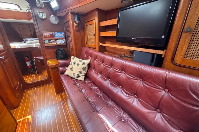 Slide: The Image of Interior of 1981 Gulfstar 44 Mk II Sloop with leather seating and wooden accents. - 53