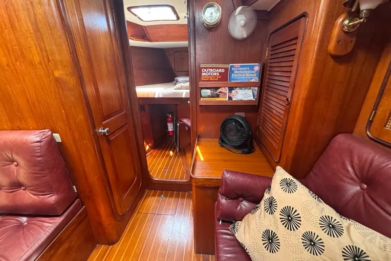 Slide: The Image of Interior of 1981 Gulfstar 44 Mk II Sloop with wood paneling and leather seating. - 54